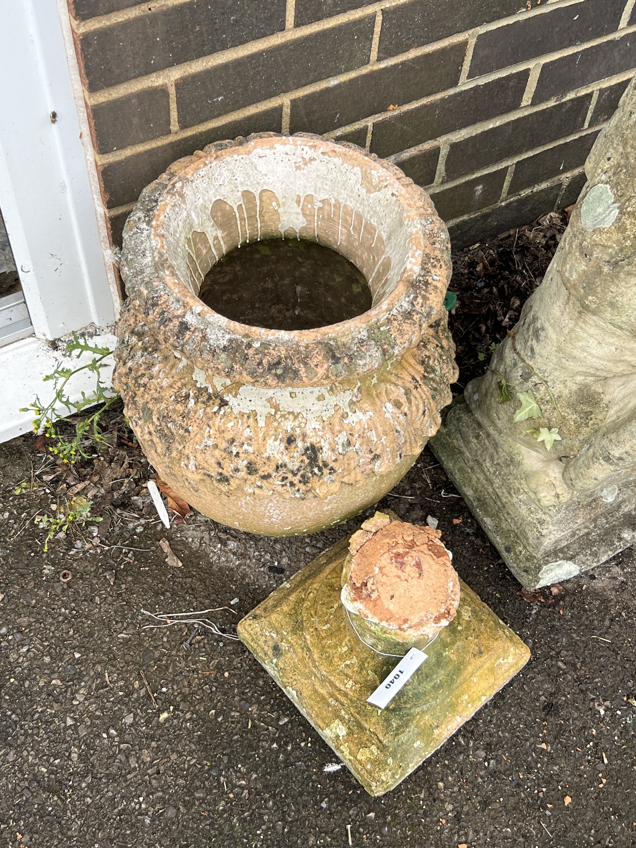 A terracotta garden urn, base detached, height 56cm